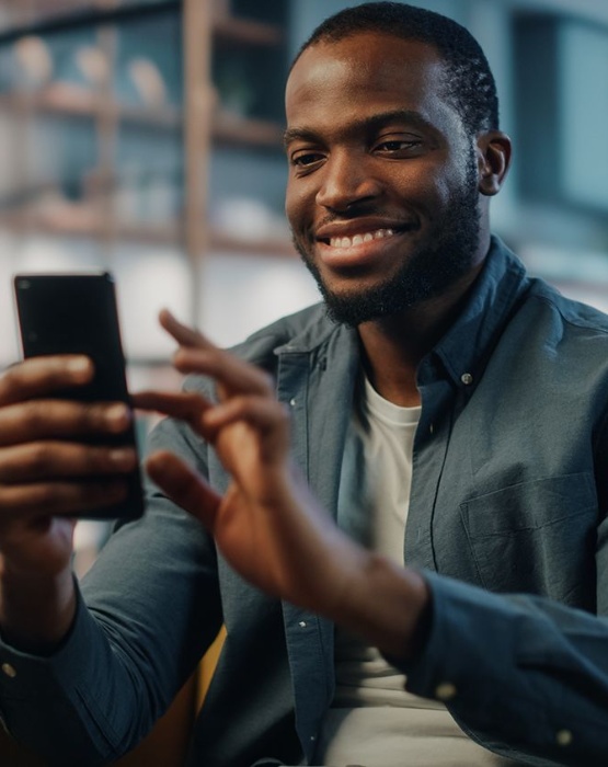 man looking at his mobile device