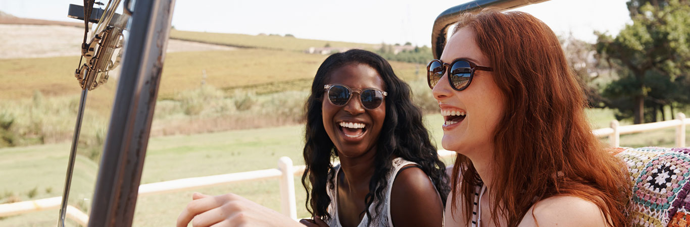 two women riding in a vehicle
