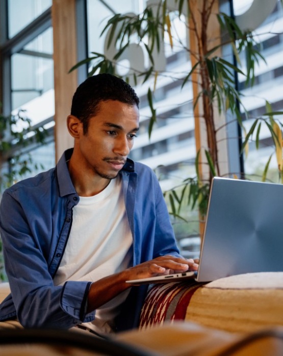 a man working on his laptop computer