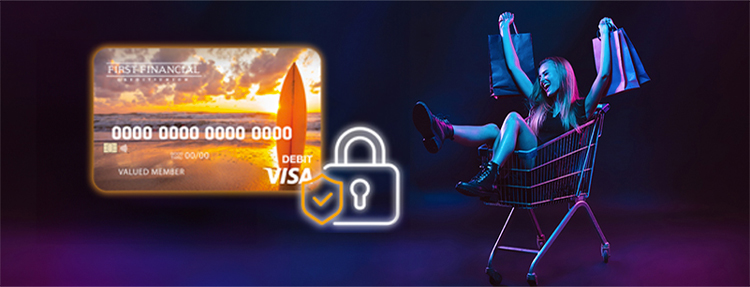Young woman rolling in a cart with shopping bags in a neon light on dark background; enjoying holiday shopping with her secure First Financial Visa Debit card.