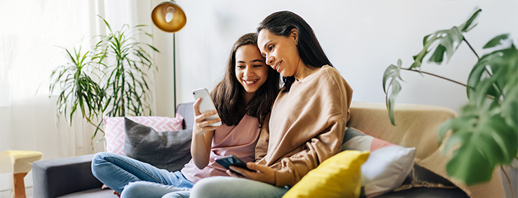 Mother and daughter reviewing her Junior checking account.